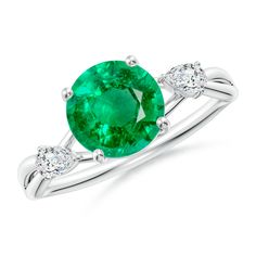 an oval emerald and diamond ring