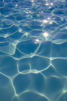 the water is very clear and it looks like they are floating in the ocean or swimming pool