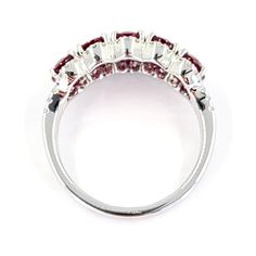 This ring is crafted in 18 Karat white gold and features 5 oval rubies totaling 2.89 Carats. Surrounding the rubies are 54 round brilliant cut diamonds of VS Clarity and G/H Color totaling 0.27 Carats. In a finger size 6.5, Jae's Jewelers includes a free ring sizing on all rings that are able to be sized at check out. Ruby And Diamond Ring, G H, Round Brilliant Cut Diamond, Brilliant Cut Diamond, Round Brilliant, Diamond Cuts, Diamond Ring, Ruby, Ring Size