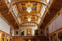 an ornate room with paintings on the walls