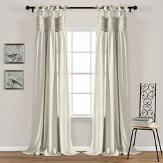 the curtains in this room are white and have ruffled trims