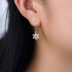 Indulge in the exquisite beauty of these stunning snowflake sterling silver dangle drop earrings, delicately crafted with 925 solid sterling silver and adorned with sparkling cubic zirconia. The intricate snowflake design exudes elegance and adds a touch of grace to your ensemble. Lightweight and comfortable, these earrings are the perfect present to show your loved ones how much they mean to you during the festive Christmas and holiday season. Embrace the magic of the snowflakes with these dazz Elegant Snowflake Shaped Cubic Zirconia Jewelry, Sparkling Snowflake Jewelry In Sterling Silver, Snowflake Shaped Sparkling Sterling Silver Jewelry, Sparkling Snowflake Sterling Silver Jewelry, Fine Jewelry Snowflake Cubic Zirconia, Snowflake Shaped Cubic Zirconia Fine Jewelry, Elegant Sterling Silver Snowflake Jewelry, Sterling Silver Snowflake Earrings, Sparkling Sterling Silver Drop Earrings