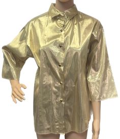 "Amazing gold metallic retro 70's button up blouse. Wow! this top is so cool and fabulous with gold buttons as well. Prefect for that next event, day  or evening out. Anything goes these days! Pair this top with jeans and a cool belt or dress it up with a skirt and fabulous heels! We love this metallic gold top for you and for anyone else who loves and collects vintage clothes! *There is slight wear on one sleeve due to age. Please see all photos.  26.5\" L 42\" Bust 40\" Waist 14\" Sleeve My photos are shots of the original item. Light or dark spots are reflections caused by the lighting. Color deviations can occur depending on the screen being used. Age of items are estimated based on my research and experience. Age differences may occur. US SHIPPING FREE  International shipping please s Trendy Gold Button-up Top, Elegant Gold Button-up Tops, Vintage Gold Long Sleeve Blouse, Affordable Gold Button-up Blouse, Gold Button-up Blouse With Button Closure, Gold Shirt, Gold Top, Vintage Eclectic, Retro 70s