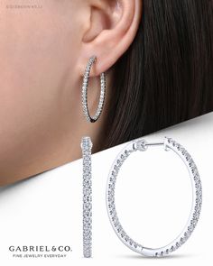 Thanks to their inside-out construction, these scalloped pavé diamond hoop earrings amp up the sparkle. Brilliant 1.90ct diamonds trace the outer and inner front edges for seamless modern glamour. Let the compliments roll in when you rock these 14k white gold diamond hoop earrings.   EG13468W45JJ #GabrielNY#DiamondJewelry#FineJewelry#GabrielAndCo#UniqueJewelry#FineJewelry#FashionJewelry#UniqueJewelry#GiftIdeas#UniqueGifts#DiamondJewelry #Jewelry#Earrings#FashionEarrings#WhiteGoldEarrings#WhiteGo Luxury Gia Certified Fine Hoop Earrings, Luxury Pave Set Hoop Earrings For Formal Events, Luxury Sterling Silver Hoop Earrings For Engagement, Luxury Hoop Earrings For Women's Engagement, Gold Diamond Hoop Earrings, Regina George, Classic Earrings, Diamond Hoop Earrings, Pave Diamonds