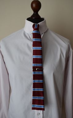 This is a fully lined made to order,  square ended tie and is made from premium grade silk.  The lining is made from brushed wool. The tie measures: Length = 134 cm Width of blade end = 6 cm You can select to have the blade end with a drawn end fringe (frayed) or the classic square end look.  The tie pictured has a classic square end look. Should you wish we can also made pocket cards to match your tie - just order from the site and indicate which material you would like. Formal Red Fitted Tie Accessories, Dapper Fitted Neckwear For Semi-formal Occasions, Red Adjustable Formal Ties, Red Adjustable Tie For Formal Occasions, Red Adjustable Ties For Formal Occasions, Adjustable Red Ties For Formal Occasions, Classic Adjustable Red Suit And Tie Accessories, Classic Red Suit And Tie Accessories, Classic Adjustable Suit And Tie Accessories For Semi-formal