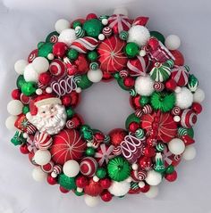 a christmas wreath with santa claus and candy canes