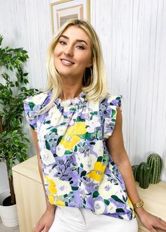 The Emes Shop blouse is detailed with a beautiful floral print. Features a ruffle neck. ruffle shoulder detail. and flowy fit. Pair it with denim jeans and sandals for a lovely look.MATERIAL:100% PolyesterMEASUREMENTS: Product Length 25.5"-27"in 4-6-Small | Waist: 25"-26.5"in | Chest: 33"-34.5"in 6-8-Medium | Waist: 26.5"-28"in | Chest: 34.5"-36"in 8-10-Large | Waist: 28"-29.5"in | Chest: 36"-37.5"in 10-12-X-Large | Waist: 29.5"-31"in | Chest: 37.5"-39"in MEASUREMENTS: Product Length 65-69... Spring Ruffle Sleeve Tops For Garden Party, Spring Brunch Blouse With Ruffled Collar, Spring Ruffled Collar Blouse For Brunch, Ruffle Sleeve Tops For Spring Garden Party, Trendy Summer Blouse With Ruffled Collar, Trendy Tops For Spring Garden Party, Summer Garden Party Top With Flutter Sleeves, Summer Garden Party Flutter Sleeve Top, Summer Floral Print Blouse With Flutter Sleeves