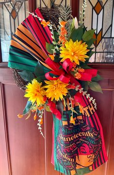 a bouquet of flowers sitting on top of a door