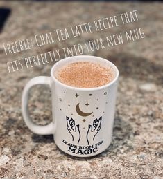 a white coffee mug sitting on top of a counter