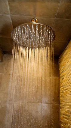 a shower head with rain coming out of it