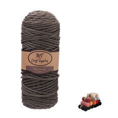 a spool of gray twine next to some colored cotton balls on a white background