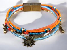 Introducing our stunning Autumn Sun Bracelet, beautifully designed with vibrant orange and blue beads. This eye-catching piece captures the essence of fall, combining colorful beads that harmonize perfectly. The soft orange suede adds a unique touch, making it both stylish and comfortable. Featuring a zamak metal magnetic clasp, this bracelet is as functional as it is fashionable! The rich colors symbolize warmth and transformation, embodying the spirit of autumn. Each bead is meticulously chosen to create a vibrant yet balanced design, bringing positivity and joy to your everyday style. This bracelet is a reminder of nature's beauty during this cozy season. Our bracelet comes in three standard sizes, ensuring a great fit for everyone. If you need a custom size, simply reach out to us, and Orange Bohemian Beaded Bracelets With Faceted Beads, Orange Bohemian Bracelets With Spacer Beads, Orange Bohemian Bracelets With Colorful Beads, Bohemian Orange Bracelets With Colorful Beads, Bohemian Orange Beaded Bracelets With Round Beads, Orange Spiritual Beaded Bracelets For Festivals, Spiritual Orange Beaded Bracelets For Festivals, Bohemian Orange Beaded Bracelets, Orange Beaded Bracelets For Jewelry Making