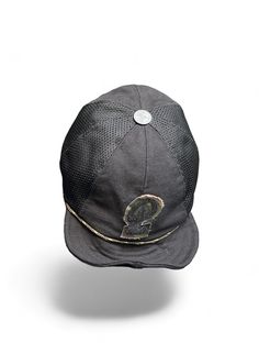 The Makshy black canvas baseball hat effortlessly blends classic style with individualistic flair. Its form-fitting design and comfortable fabric ensure a polished look, while the customisable letter motif and antique-style metal squatchee add a touch of vintage charm. This fashion-forward cap offers versatility with its adjustable and rollable visor, perfect for adapting to different styling preferences. Crafted for convenience, its foldable design makes it ideal for on-the-go wear and easy packing during travels. Metal eyelets enhance breathability, ensuring comfort in any weather. FEATURES * Black cotton canvas cap with nylon mesh  * Foldable eight-panel unisex design * Adjustable and rollable visor with built-in wire * Customisable camouflage fabric contoured black velcro letter emblem Functional Black Mesh Hat, Black Breathable Short Brim Hat, Black Fitted Hat With Short Brim For Outdoor, Black Fitted Baseball Cap With Short Brim, Black Six-panel Fitted Hat, One Size Fits Most, Black Breathable 5-panel Hat, Black Six-panel Fitted Hat, Black Urban Flat Cap, Urban Black Flat Cap