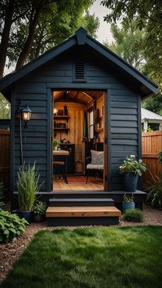 a small black shed with its door open