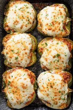 stuffed bell peppers with cheese and herbs in a baking dish, ready to be eaten