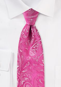 This trendy tie in Dragon Fruit Pink paisley is just what you need for the men in your wedding party who are on the taller side. This necktie is ideal for guys who are 6 feet 2 inches or taller, as well as for larger men who want additional tie length for a comfortable fit. The paisley pattern in pink is densely woven into the fabric, and some silver is weaved in for definition. This gives the appearance of a light texture, and as the light catches it, it shimmers beautifully. It pairs exception Wedding Paisley Print Tie, Elegant Paisley Print Wedding Suit Accessories, Elegant Wedding Suit And Tie Accessories With Paisley Print, Wedding Paisley Print Standard Tie, Fitted Paisley Print Suit And Tie Accessories For Wedding, Elegant Wedding Ties With Paisley Print, Wedding Ties With Paisley Print, Purple Tropical, Navy Tuxedos