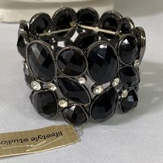 This Beautiful Stretch Bracelet Is Full Of Different Sizes And Shapes Of Black Faceted Stones With Clear Rhinestones Scattered Throughout The Bracelet. New And Never Worn. See Pictures For Details Ask Any Questions Bundle For Extra Savings Happy Poshing Elegant Adjustable Crystal Stretch Bracelet, Elegant Metal Crystal Bracelet With Stones, Elegant Adjustable Stretch Bracelet With Rhinestones, Elegant Adjustable Rhinestone Stretch Bracelet, Silver Crystal Metal Bracelet With Stones, Silver Metal Crystal Bracelet With Stones, Metal Crystal Bracelet With Stones For Party, Silver Bracelets With Stones For Party, Silver Bracelet With Stones For Party