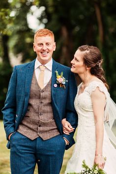 a bride and groom smile at each other