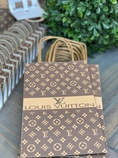 louis vuitton notebooks lined up on a table