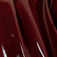 close up view of shiny red plastic material