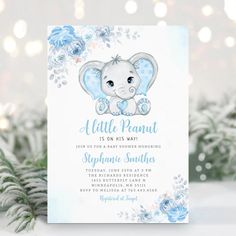 an elephant baby shower party with blue flowers