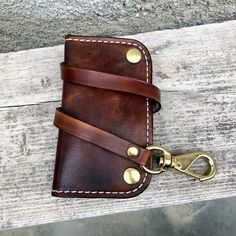 Italo model wallet, Indestructible wallet with 5 pockets, handmade and hand-dyed in vegetable-tanned leather from Tuscany, equipped with a real bronze carabiner. Unique wallet! Dimensions when closed: 10x17 cm Possibility of personalized laser engraving Leather Wallets With Interior Key Chain Holder, Brown Rectangular Wallet With Key Clip, Brown Bifold Wallet With Key Clip, Brown Wallet With Belt Clip For Everyday Carry, Leather Trifold Wallet With Key Chain Holder, Leather Trifold Wallet With Key Chain Holder For Everyday, Leather Wallet With Key Leash For Daily Use, Leather Wallets With Key Leash For Daily Use, Leather Trifold Wallet With Belt Clip For Everyday