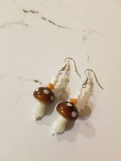 Bohemian glass mushroom earrings! Perfect addition to any outfit. 🍄  Find the matching bracelet here!: https://www.etsy.com/listing/1152358599/mushroom-beaded-bracelet-mushroom Shipping info: Your item will be shipped 1-2 business days once you place your order. Tracking is always included unless noted otherwise. For custom or wholesale items, message me on here or on Instagram @ sapphire__creations Earrings Mushroom, Mushroom Jewelry, Glass Mushrooms, Earrings Beaded, Jewelry For Her, Matching Bracelets, Glass Earrings, Beaded Earrings, Jewelry Earrings Dangle