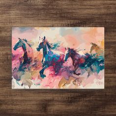 three horses running in the wind on a wooden surface with paint splattered over it