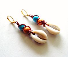 Wire Wrapped Cowrie Shell Dangle Earrings Boho Chic Earrings Bohemian Wrap Earrings With Ear Wire, Traditional Nickel-free Earrings For Beach, Beach Beaded Metal Earrings, Bohemian Shell Earrings Nickel Free, Nickel Free Shell Bohemian Earrings, Metal Beaded Earrings For Beach, White Wire Wrapped Bohemian Earrings, Bohemian Nickel-free Shell Earrings, Bohemian Metal Wrap Earrings