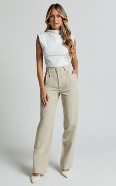 Get ready to elevate your workwear game with the Brionne Top. This high-neck, cap-sleeve top in classic white is a must-have addition to your fashion tops collection. Made from 100% polyester, it offers a sleek and stylish look that meets the highest standards of style and comfort. Whether you're heading to the office or meeting up with friends after work, this versatile top is perfect for any occasion. Pair it with tailored pants or a chic skirt for an effortlessly polished look that will make Beige Corporate Attire, Business Casual Wardrobe Essentials, Nursing Conference Attire, Two Piece Work Outfit, Corperate Outfits Women, Business Wear Aesthetic, Service Advisor Outfits, Architecture Presentation Outfit, Women’s Work Fashion Summer