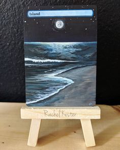 a small easel with a painting on it