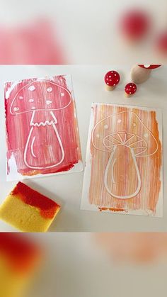 three handmade cards with red and orange designs on them, one has a candy bag