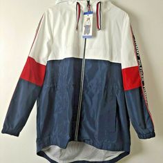 Tommy Hilfiger Lightweight Hooded Windbreaker Jacket Drawstring Hood Zipper Closure Side Pockets Long Sleeves With Elasticed Cuffs Logo On Sleeves And Back Of Jacket 100% Polyester Machine Washable 31" Long Tommy Hilfiger Women, Windbreaker Jacket, Tommy Hilfiger, Bomber Jacket, Zipper, Jackets & Coats, Jackets For Women, ? Logo, Long Sleeve