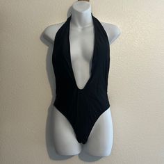 Nwot Black Medium One Piece Backless With Strap. Removable Cups 80% Nylon 20% Spandex Chic Stretch Bodysuit With Triangle Top, Fitted Triangle Top Bodysuit For Night Out, Night Out Bodysuit With Triangle Top, Night Out Triangle Top Bodysuit With Lined Body, Triangle Top Bodysuit For Night Out, Solid Triangle Top Bodysuit For Party, Fitted Nylon Bodysuit With Triangle Top, Fitted Triangle Top Nylon Bodysuit, Solid Color Triangle Top Bodysuit For Party