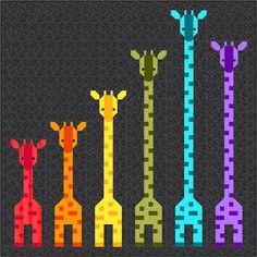 a group of giraffes standing next to each other on a gray shirt