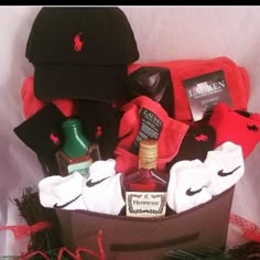 a gift basket filled with clothing and hats