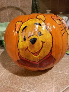 a winnie the pooh pumpkin sitting on top of a counter