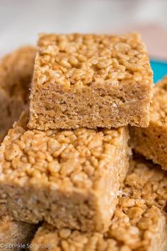 several pieces of oatmeal bars stacked on top of each other in a blue plate