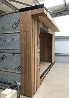 the inside of a building being built with wooden walls and insulations on the floor