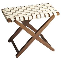 a wooden and white stool with woven seat