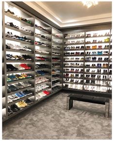 a room filled with lots of shoes on shelves