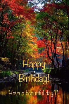 a river surrounded by trees with the words happy birthday have a beautiful day