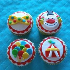 three cupcakes with clown faces on them