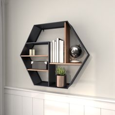 Organize and decorate in style with this black and brown hexagon wall shelf that would easily complement your industrial-themed home space. This item ships in 1 carton. Easy to hang with back keyhole hooks; nails and screws are not included. Suitable for indoor use only. Maximum weight limit is 20 lbs. This is a single wall shelf. Fir wall shelf features 5 shelves. Industrial style. Grayson Lane 29.5-in L x 6.75-in D x 25.75-in H Black Hexagon 5 Shelves Wood Angular Tiered Shelf (5 Shelves) | 43 Hexagon Wall Shelf, Pipe Bookshelf, Iron Pipe Shelves, Black Wall Shelves, Vintage Inspired Wall Decor, Shelves Industrial, Hexagon Wall, Wood Hexagon, Tiered Shelf