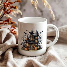 a white coffee mug with a halloween scene on it