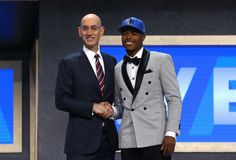 two men shaking hands in front of a blue and white background with the words, pick 9 dallas mavericks