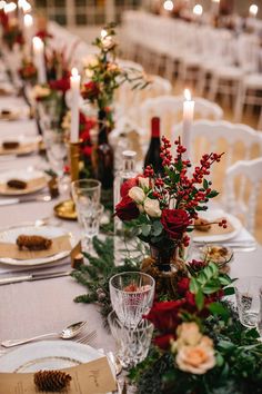 the table is set with place settings and candles