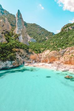 an aerial view of the blue lagoons and cliffs in caprifica national park, italy