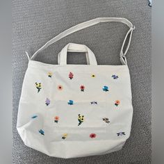 Gorgeous Bag! Never Used, Still With Tags, Lovely And Thick Canvas Material, Great Zipper Small Grey Stain Mark On Bag. White Embroidered Shopping Bags, Summer Shoulder Bag With Embroidered Logo For Daily Use, Everyday Tote Shoulder Bag With Floral Embroidery, Everyday Embroidered Canvas Shoulder Bag, Multicolor Embroidered Bags For Everyday Spring Use, Everyday Floral Embroidered Tote Shoulder Bag, Everyday Floral Embroidery Tote Shoulder Bag, White Cotton Shoulder Bag For Errands, Casual Embroidered Shoulder Bag For Everyday