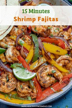 a pan filled with shrimp and peppers next to tortillas